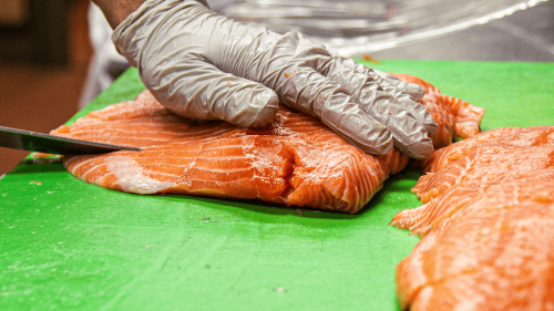 Staff preparing salmon at Crawdaddy's Restaurant in Visalia